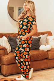 Pumpkin Patch Pajama Set with short sleeves and pants, featuring a dark green base with an all-over jack-o'-lantern print.