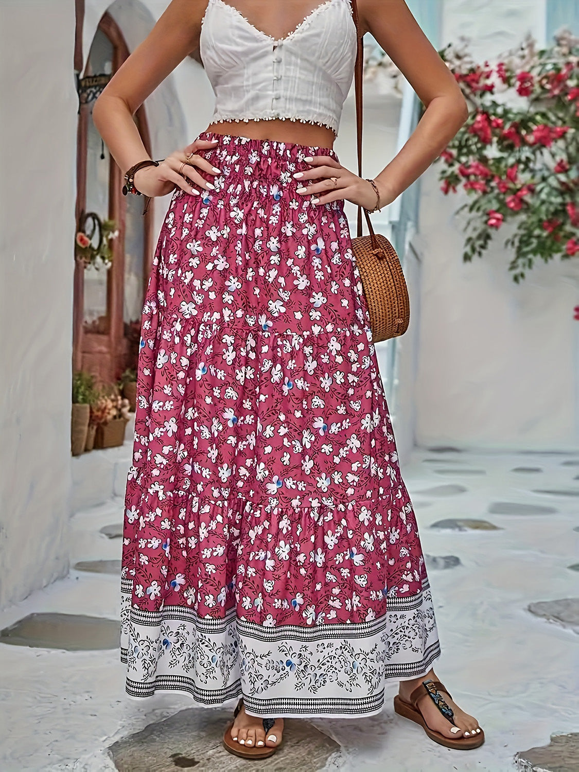 Maxi tiered skirt in cerise with a white floral print and border detail.