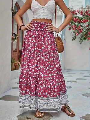 Maxi tiered skirt in cerise with a white floral print and border detail.