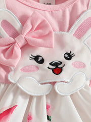 Pink baby dress with bunny applique, bow, and floral skirt.