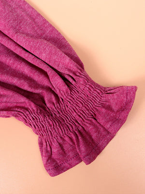 Off-shoulder ruffled sleeve top in hot pink with smocked cuff detail