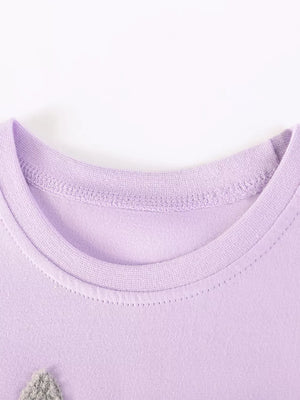 Lavender cotton baby dress with bunny appliqué detail at neckline.