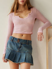 Dusty pink ribbed crop top with lettuce hem and scoop neck.
