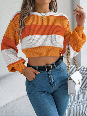 Striped balloon sleeve crop knit sweater in tangerine, sky blue, or cerise, made of acrylic.