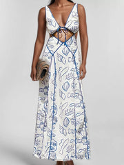 Blue oceanic print backless maxi dress with cutouts and tie front.