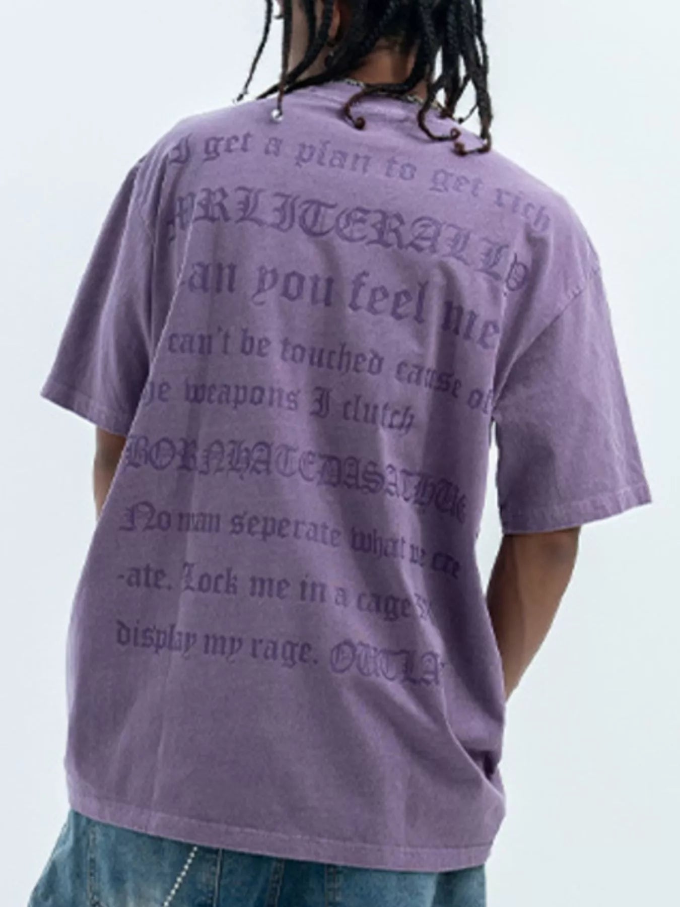 Purple oversized graphic tee with gothic text print on back, 100% cotton.