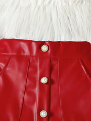 Red faux leather baby skirt with decorative pearl buttons and pleats.