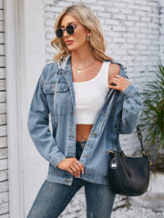 Oversized denim jacket in dusty blue with hood detail and buttoned front.