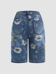 Blue botanical print denim shorts with a relaxed fit and classic five-pocket styling.