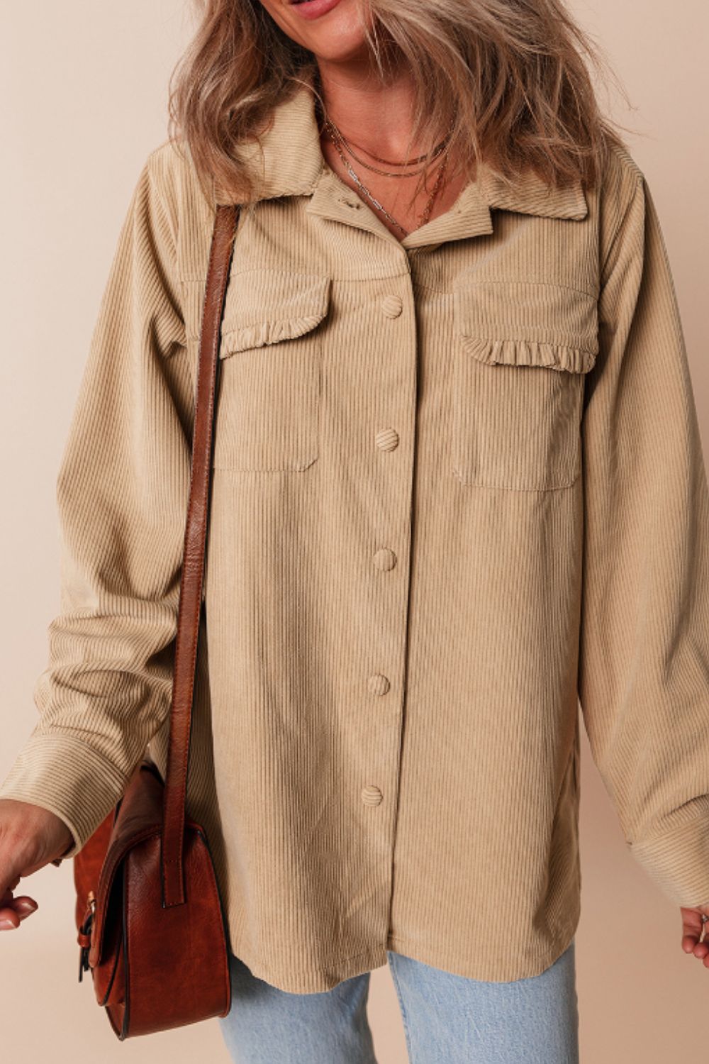 Tan corduroy utility shirt with ruffled chest pockets and button front.