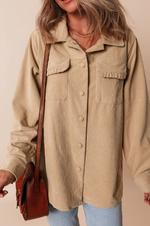 Tan corduroy utility shirt with ruffled chest pockets and button front.