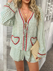 Light green gingham loungewear set with heart pockets and red trim, tie-front top and shorts.