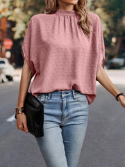 Textured dot back-tie blouse in Dusty Pink with short sleeves and a mock neck.