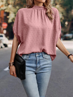 Textured dot back-tie blouse in Dusty Pink with short sleeves and a mock neck.