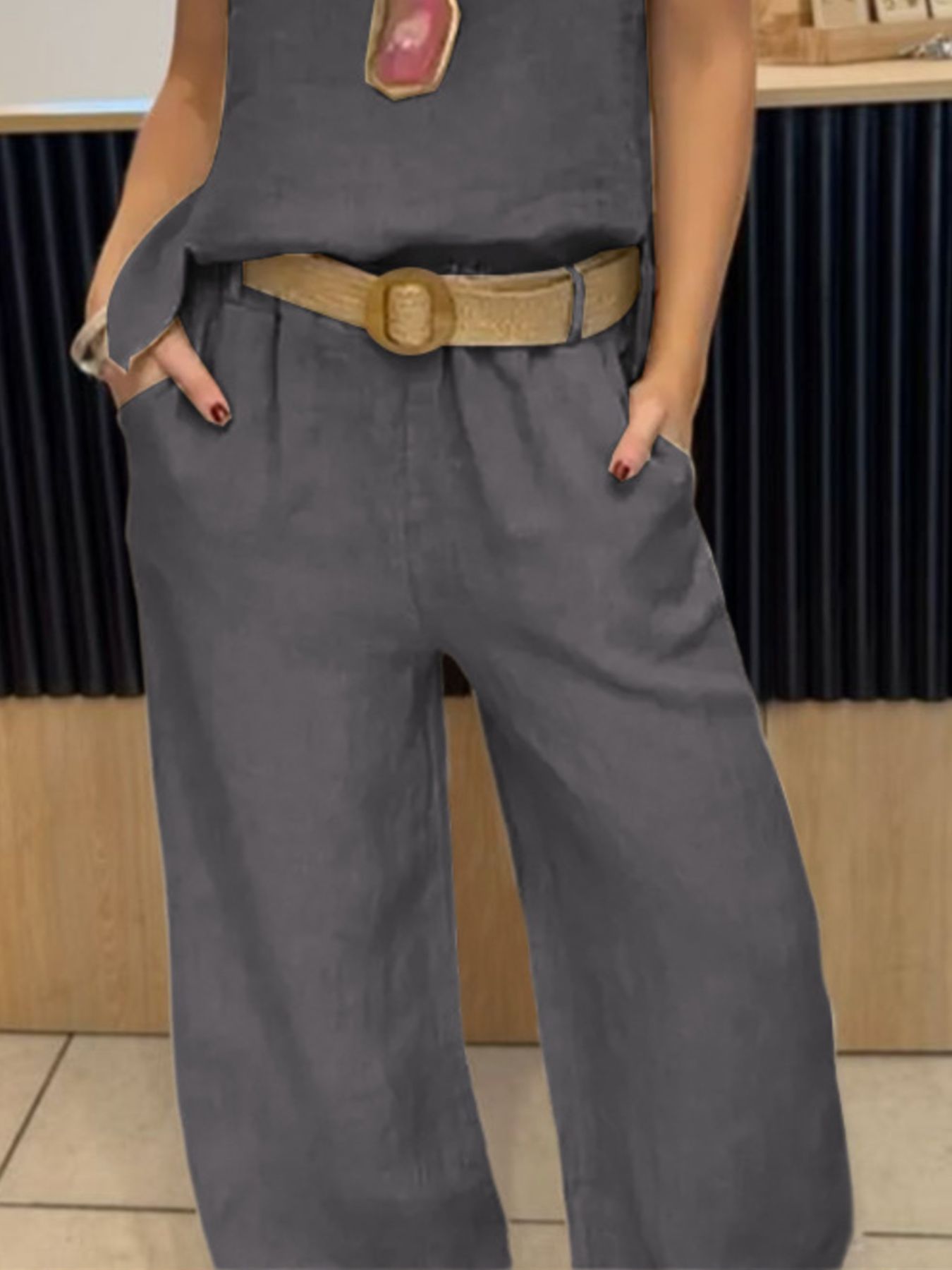 Grey relaxed fit tank and wide-leg pants set with a tan belt and pockets.