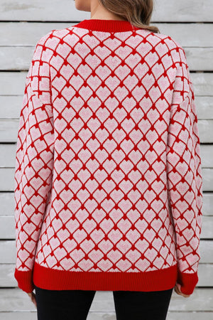 Heart grid crewneck knit sweater in pink and red acrylic with a diamond heart pattern.