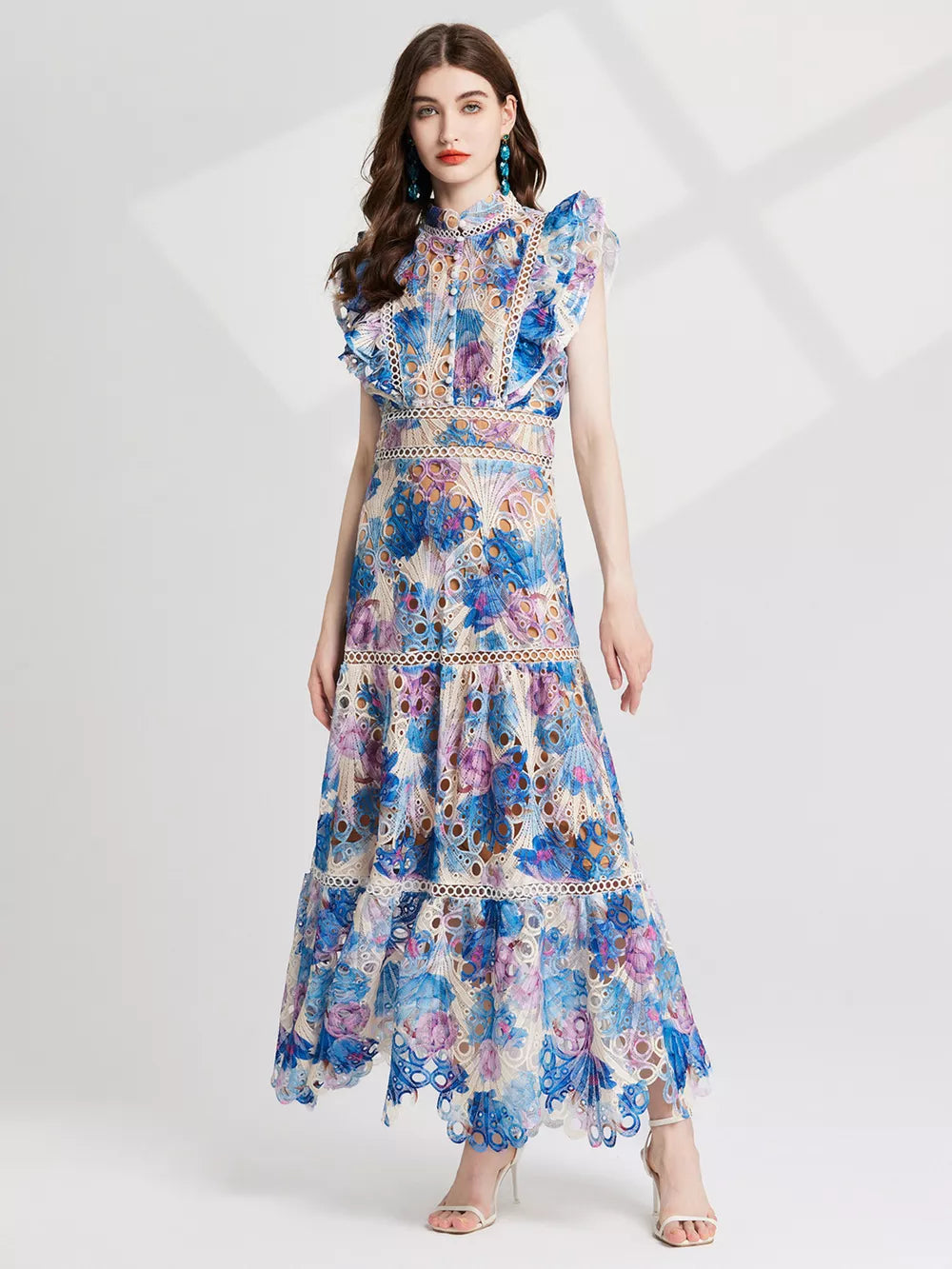 Blue and purple floral lace maxi gown with cutout details and ruffled sleeves.
