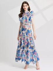 Blue and purple floral lace maxi gown with cutout details and ruffled sleeves.