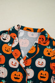 Adult pumpkin patch pajama set with collar and button detail, featuring jack-o'-lantern print.