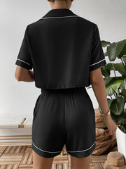 Black cropped pajama set with contrast trim, short sleeves and shorts