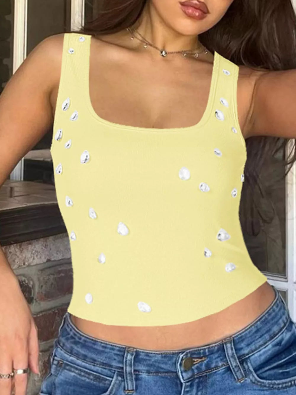Yellow cropped tank top with square neck and scattered rhinestone embellishments.