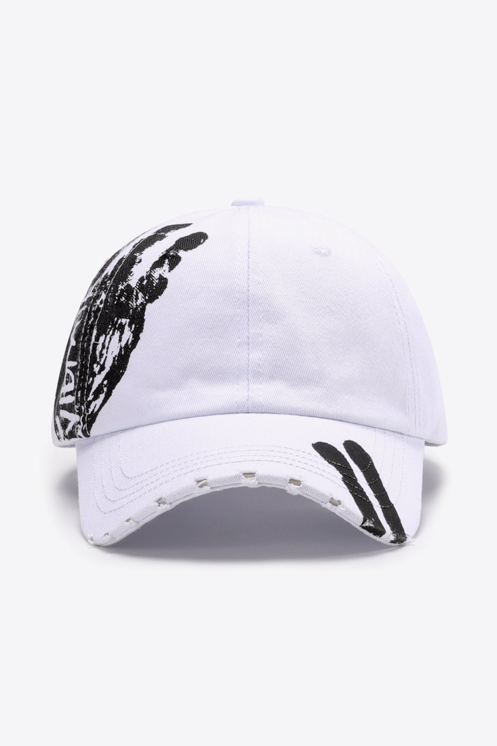White baseball cap with black graffiti art and distressed brim.