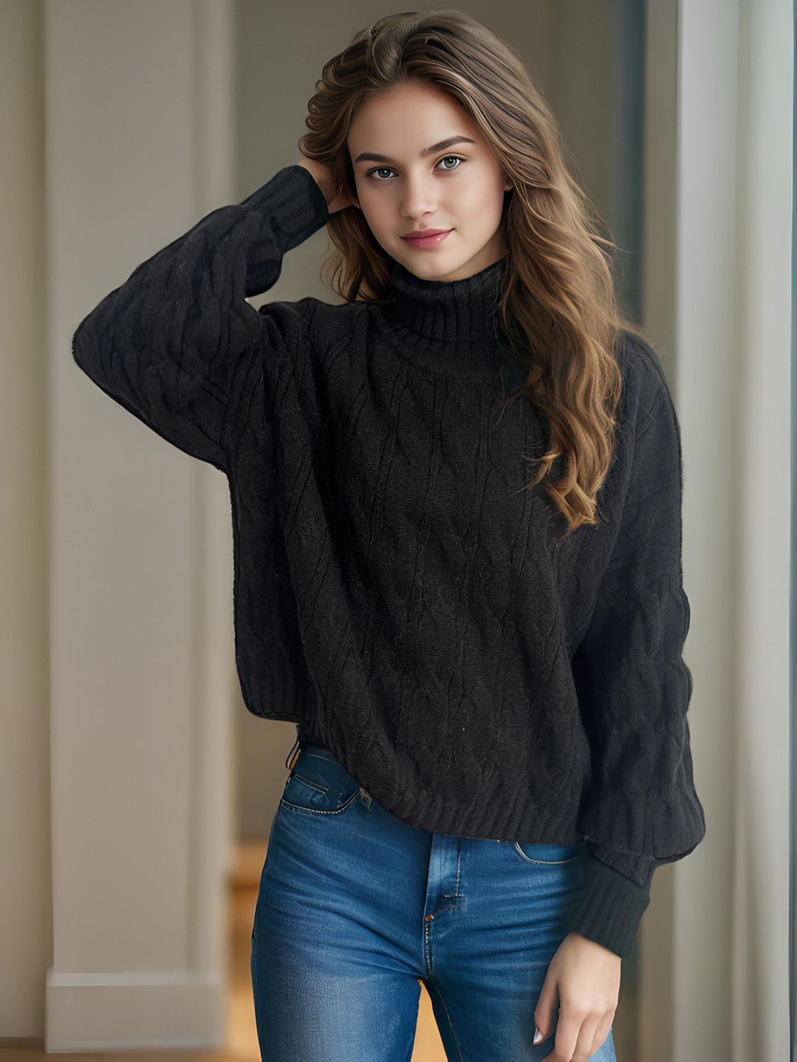 Black oversized cable knit turtleneck sweater with diamond pattern detail