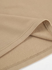 Camel quarter zip top and pants set detail showing soft fabric and stitching.