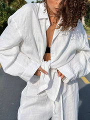 Relaxed fit white linen button-up shirt and pants set, tied at waist