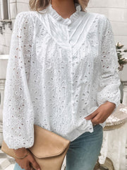 White eyelet embroidered blouse with ruffle collar and button front.