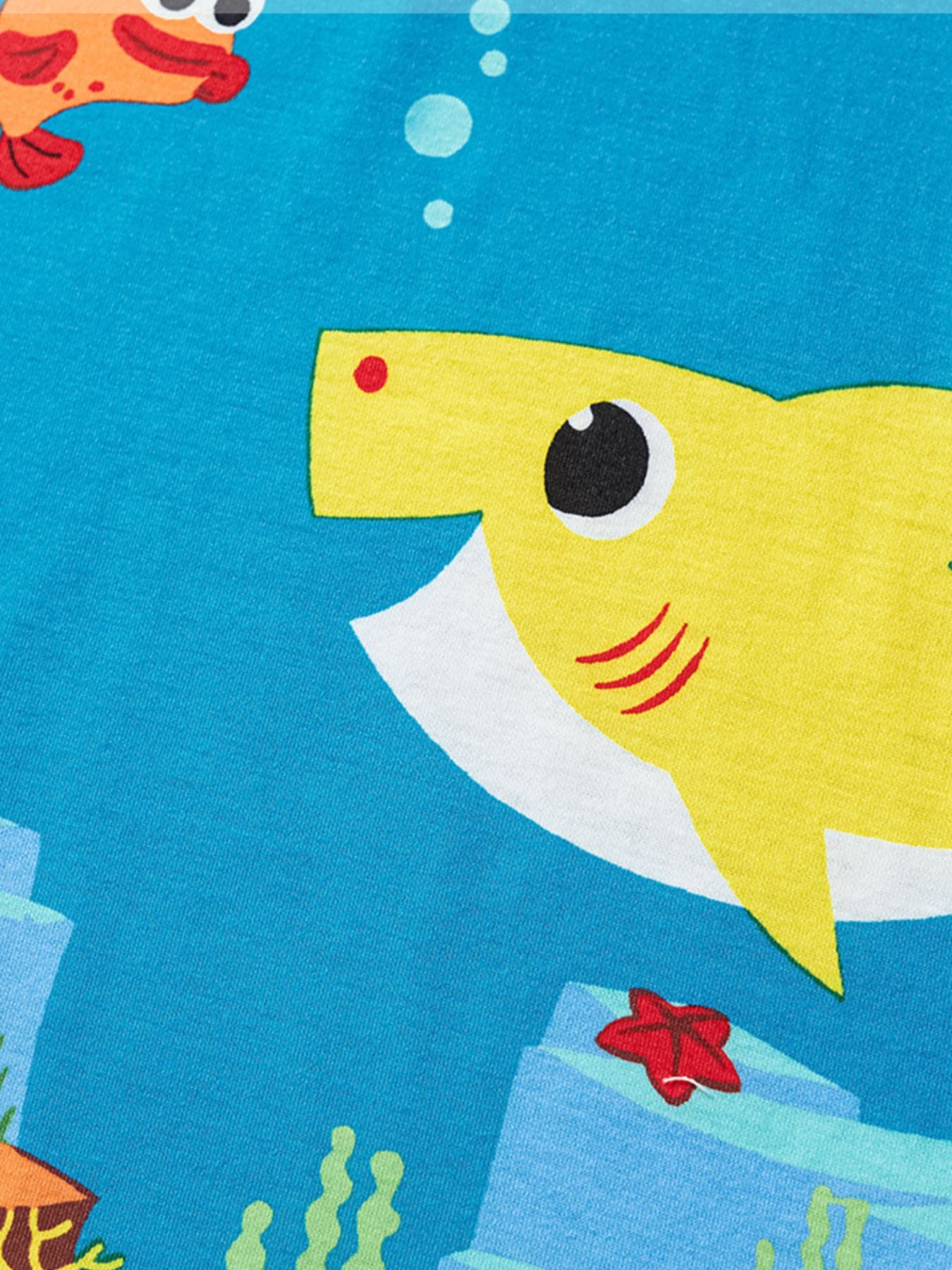 Toddler t-shirt with a playful yellow shark and orange fish print on blue.