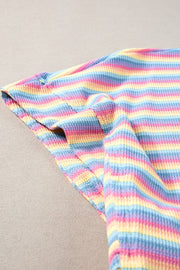 Rainbow stripe cotton culotte jumpsuit with drawstring detail.