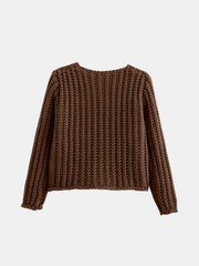 Brown chunky knit cardigan with long sleeves and ribbed cuffs.