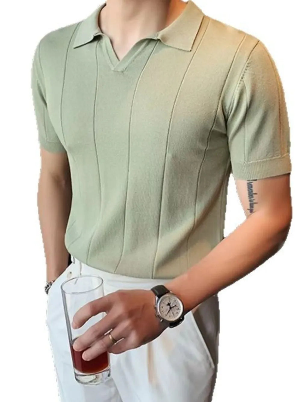 Sage green knit polo shirt with vertical ribbing and short sleeves.