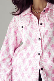 Pink diamond weave shacket with puff sleeves and buttoned front.