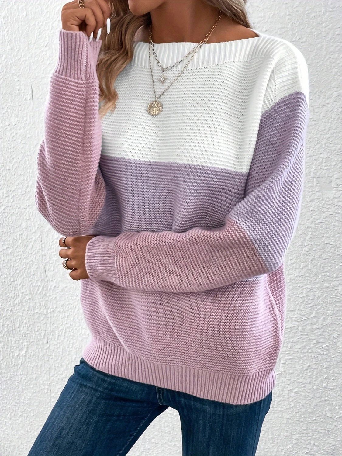 Colorblock ribbed knit sweater with boatneck in white, lavender, and pink.