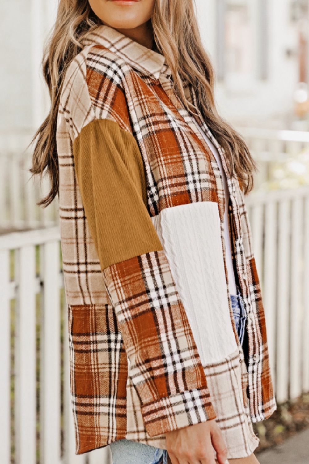 Patchwork plaid knit shacket in sherbet with contrasting corduroy and cable knit sleeves.