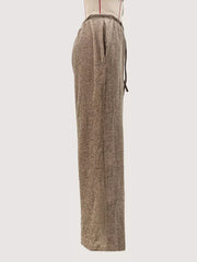 Khaki wide-leg drawstring pants with a ribbed texture and side pockets.