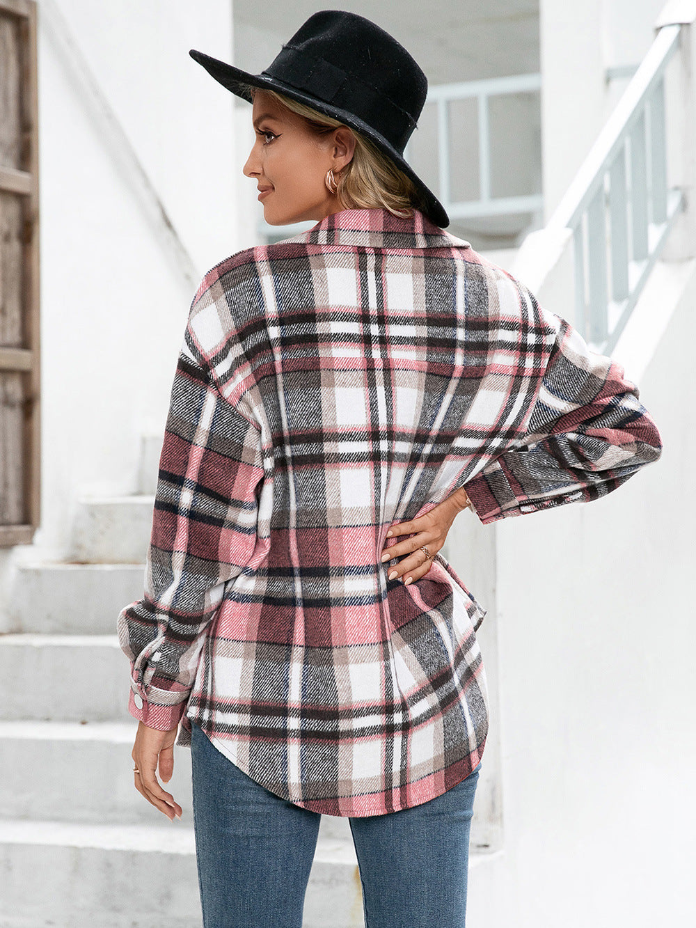 Oversized plaid flannel shacket in blush pink with buttoned cuffs and patch pockets.