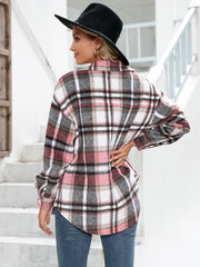 Oversized plaid flannel shacket in blush pink with buttoned cuffs and patch pockets.