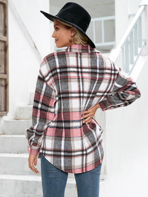 Oversized plaid flannel shacket in blush pink with buttoned cuffs and patch pockets.