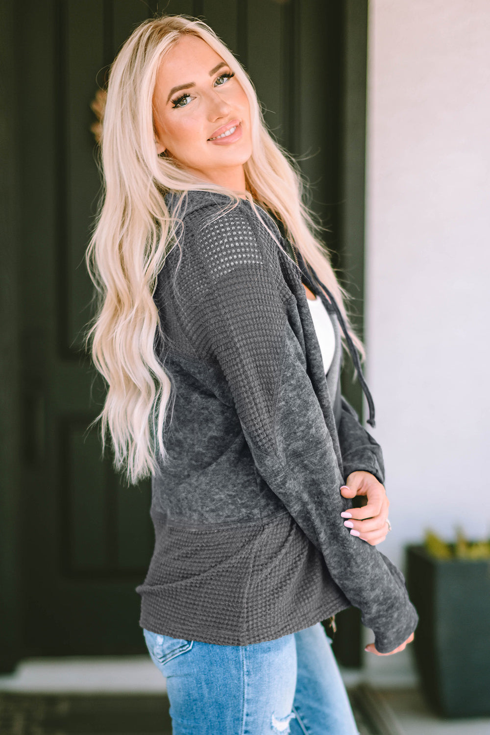 Colorblock knit zip-up hoodie in charcoal with waffle texture and mesh details.