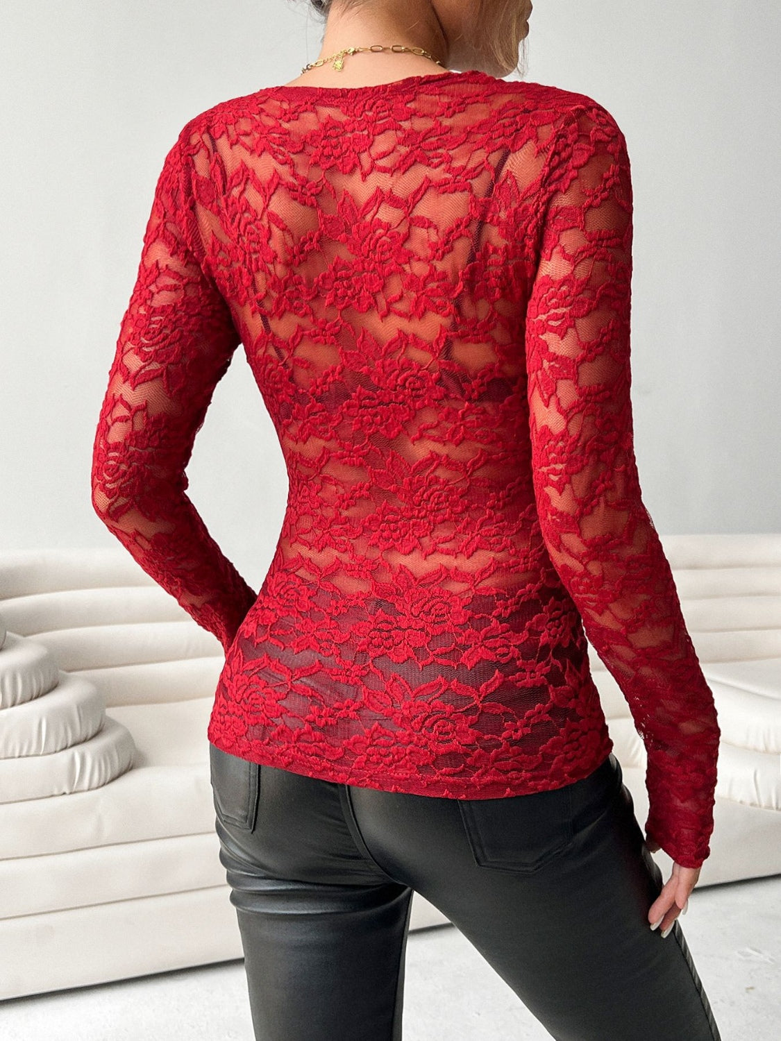 Scalloped lace second-skin top in scarlet with long sleeves and a floral pattern.