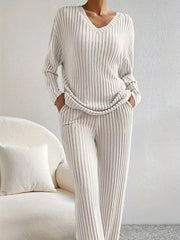 Ribbed knit loungewear set in off-white with V-neck top and pants.