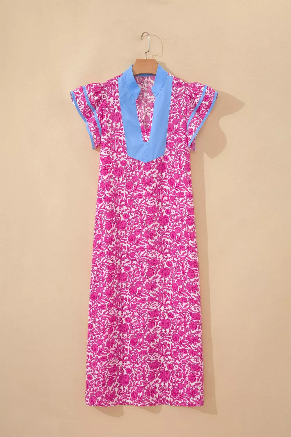 Vibrant floral midi dress with ruffle sleeves and blue V-neck collar.