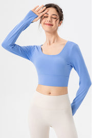 Sky blue long sleeve crop top with thumbholes and square neckline