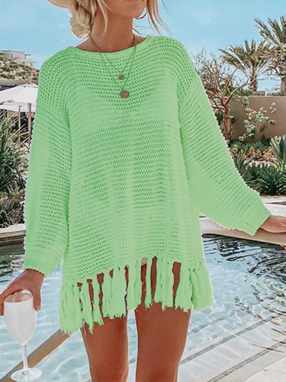 Neon Green open-knit acrylic beach cover-up with fringe hem and long sleeves.