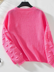 Hot Pink knit sweater with textured sleeve details and ribbed cuffs.