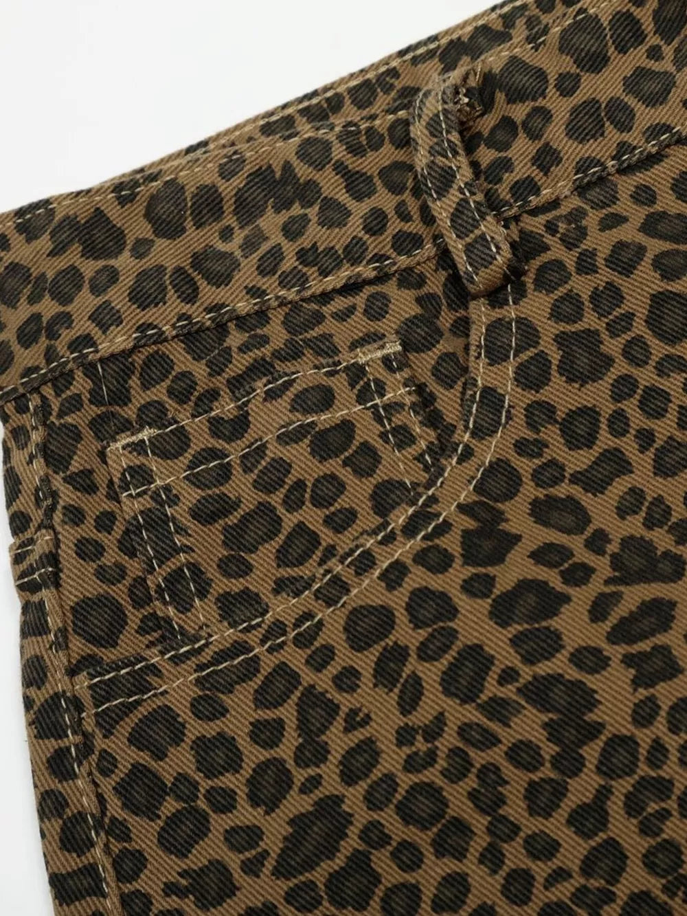 Men's brown leopard print wide-leg capris with contrast stitching and pocket detail.