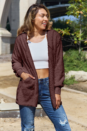 Plush hooded cardigan jacket in brown with pockets and long sleeves.